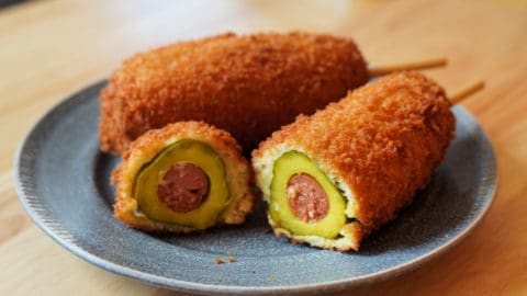 Pickle corn dog cut in cross section.