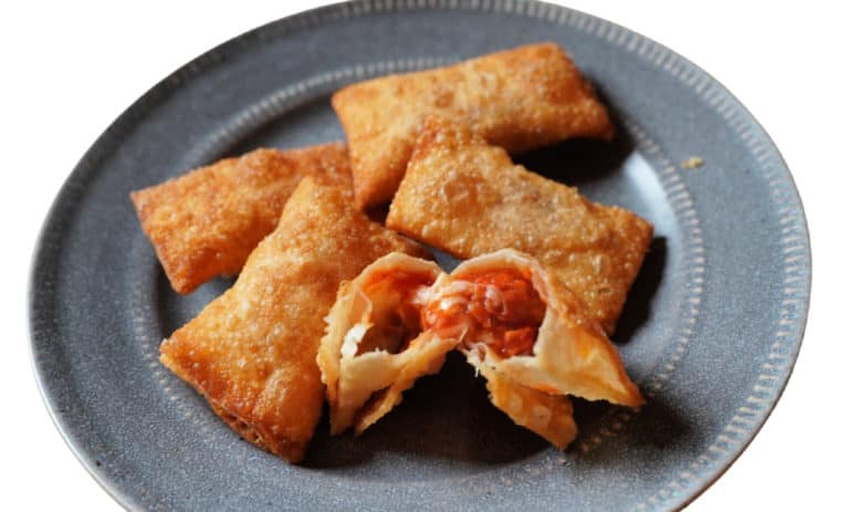 A grey plate with homemade Totino's pizza rolls.