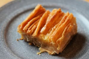 A golden brown crinkle on a grey plate.