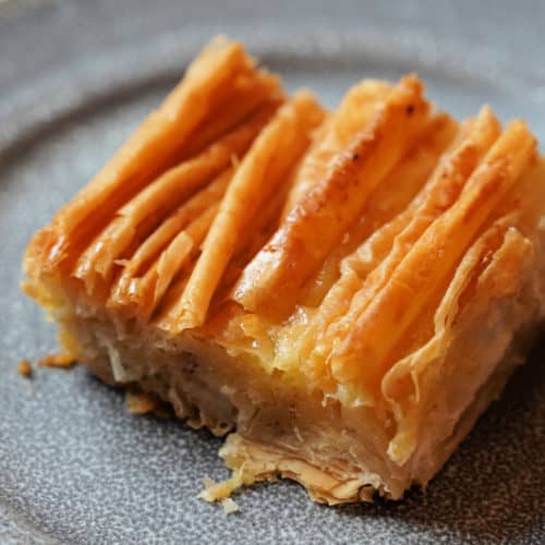 A golden brown crinkle on a grey plate.