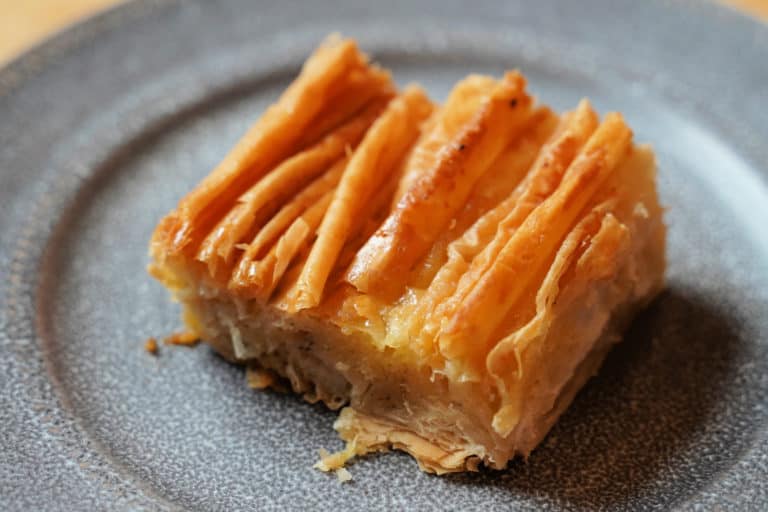 A golden brown crinkle on a grey plate.