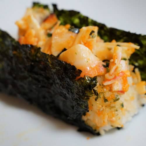 Baked sushi wrapped in a nori sheet.